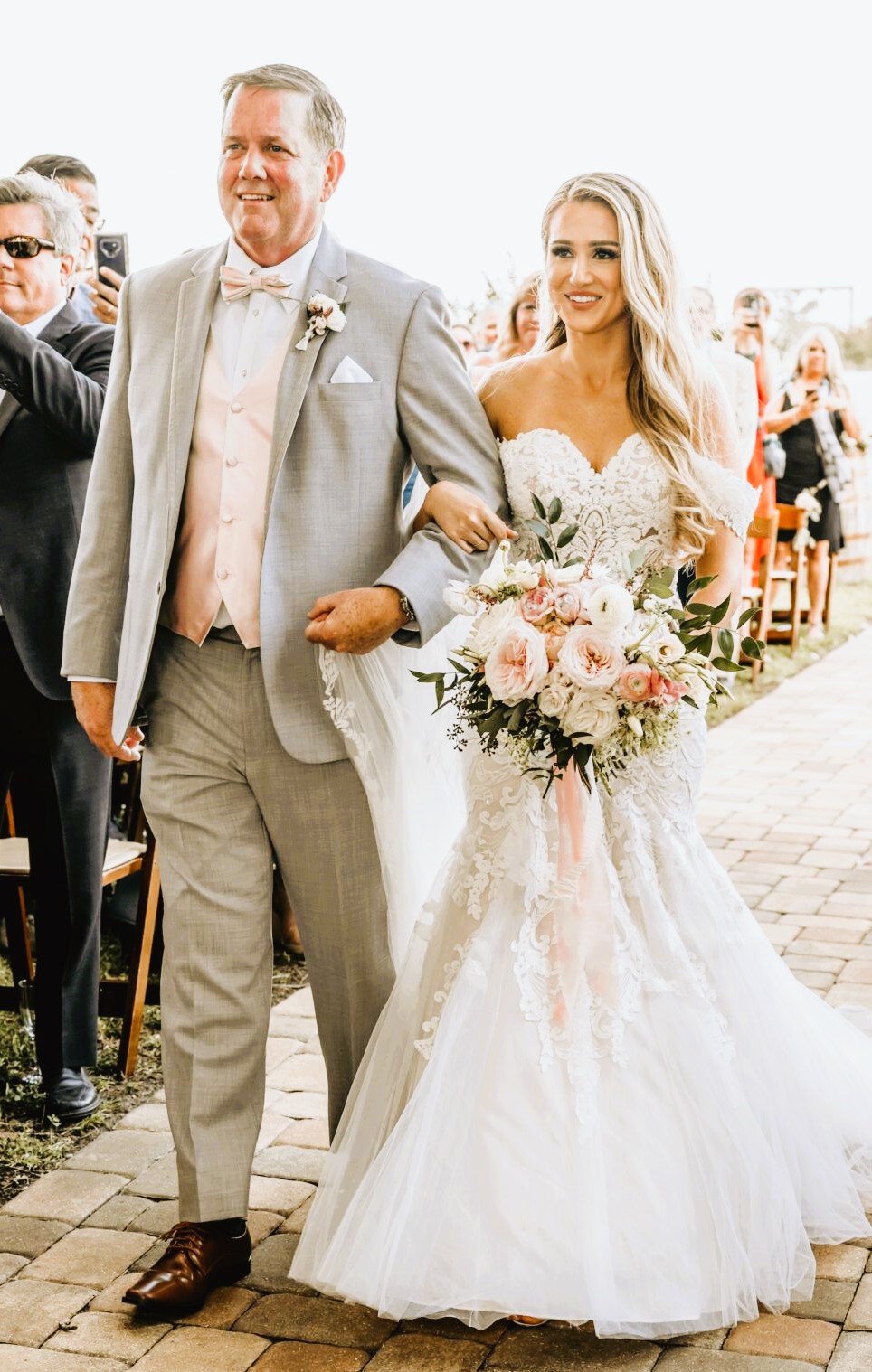 Bride walking down aisle with father