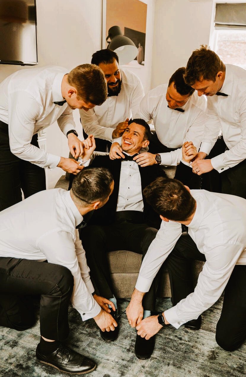 Groom Tying Shoes