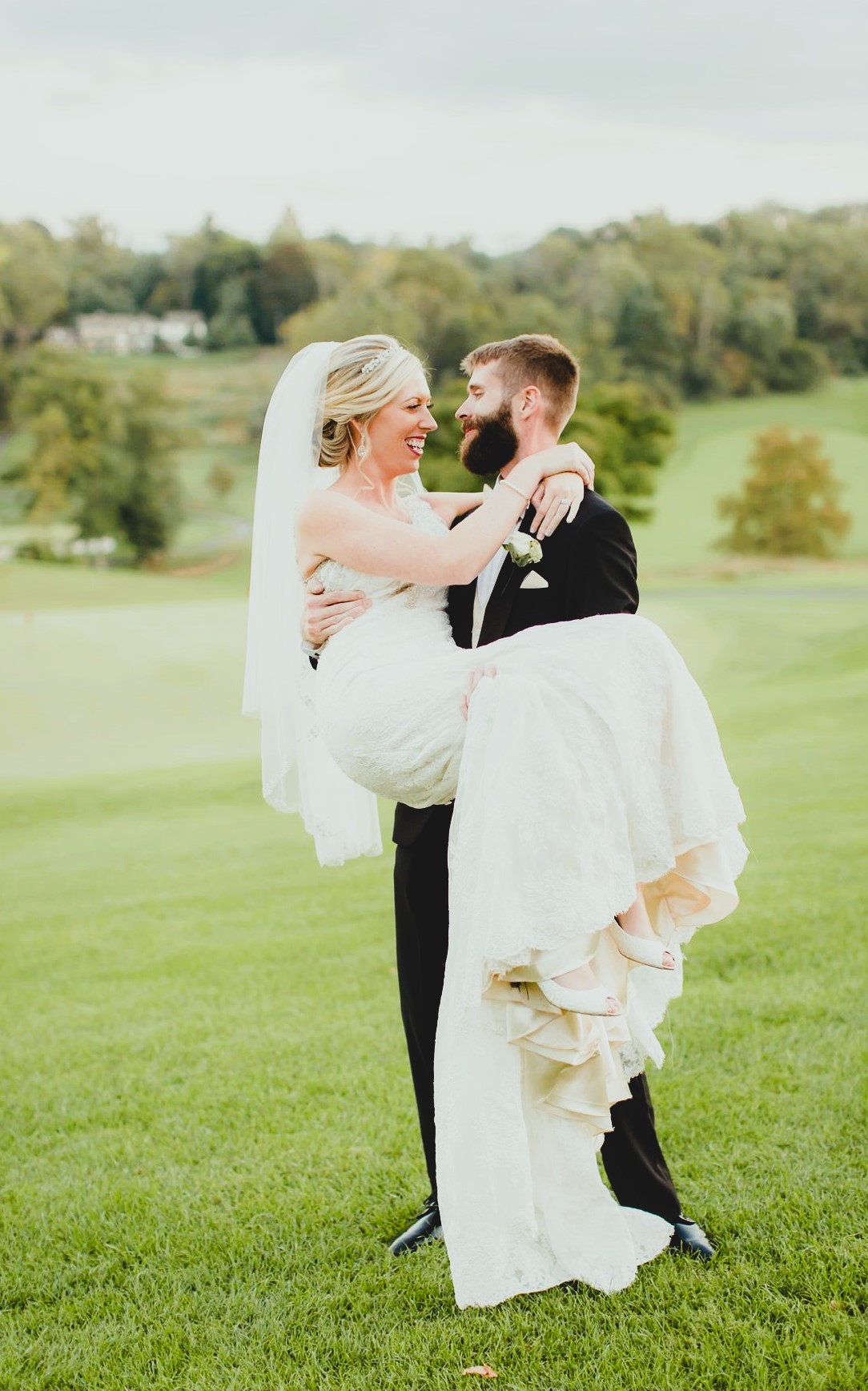 Groom lifting bride