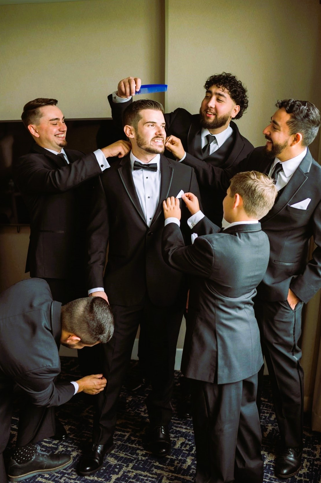 Groomsmen toasting with groom in center