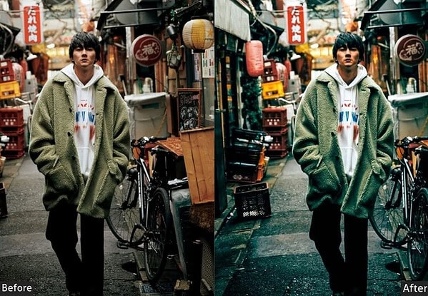 Young man in a green coat standing on a busy Tokyo street at night, showcasing vibrant city lights and urban atmosphere, ideal for travel and cityscape photography.