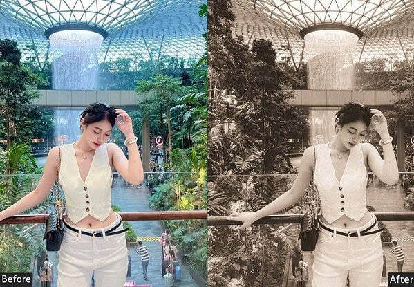 Young woman enjoying a waterfall light display at a modern indoor garden in Tokyo, vibrant colors, lush greenery, and architectural design.